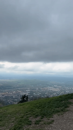 Panoramic cityscape view captured from hilltop in Goryachevodsky, Russia
