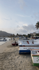Fishing boats at dusk on Juan Griego's shore