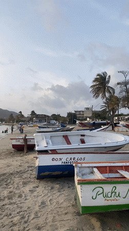 Fishing boats at dusk on Juan Griego's shore