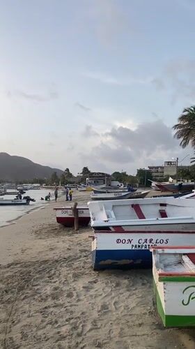 Fishing boats at dusk on Juan Griego's shore