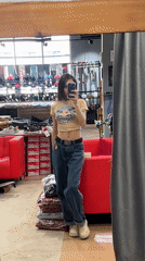 Woman takes mirror selfie while shopping in Krasnoyarsk store
