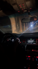 Night drive captured through Abuja streets under advertising overpass