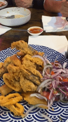 Diner enjoys Peruvian lomo saltado dish in Barcelona restaurant