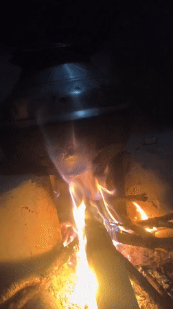 Open fire cooking on a rainy morning in the Dharamsala foothills