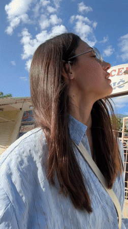 Woman in striped shirt spotted outdoors in Sutomore