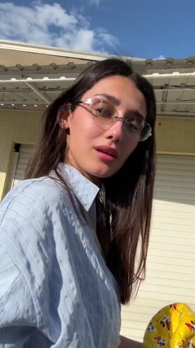 Woman in striped shirt spotted outdoors in Sutomore