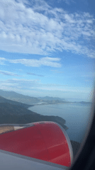 Aerial view captured over Đà Nẵng coastal landscape from aircraft