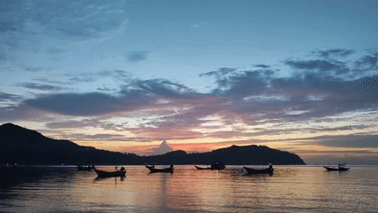 Sunset colors and a red kayak on Ko Pha-ngan's shore