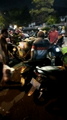 Nighttime motorcycle meetup in a Semarang street parking area