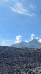 Tourists capture volcanic landscape views in Kintamani, Indonesia