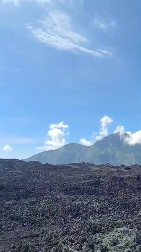 Tourists capture volcanic landscape views in Kintamani, Indonesia