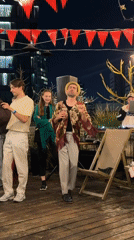 Evening rooftop party with string lights in Tel-Aviv