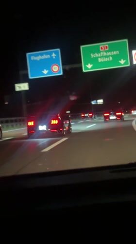 Night highway driving footage captures multiple Mustangs near Kloten