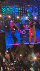 Nigerian club gathering and street scene documented in Obosi