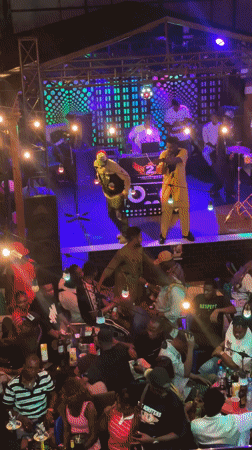 Nigerian club gathering and street scene documented in Obosi