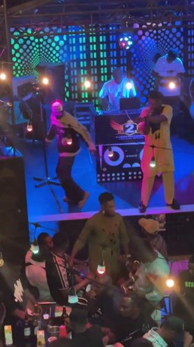 Nigerian club gathering and street scene documented in Obosi
