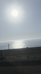 Ocean sunrise viewed from coastal road near Tijuana