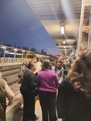 Evening rush hour crowds pack train at Canet de Mar