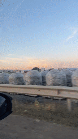 Sunset drive through Sofia, construction zones in the mirror