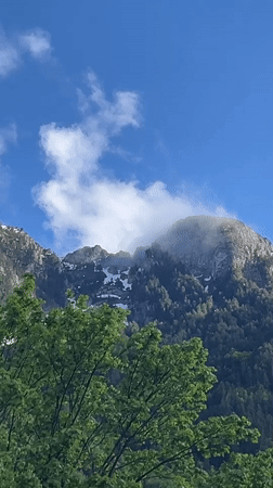 Mountain vista captured in Kaludra, Montenegro shows snow-capped peaks