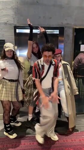 Young adults dance and primp in Tashkent elevator area