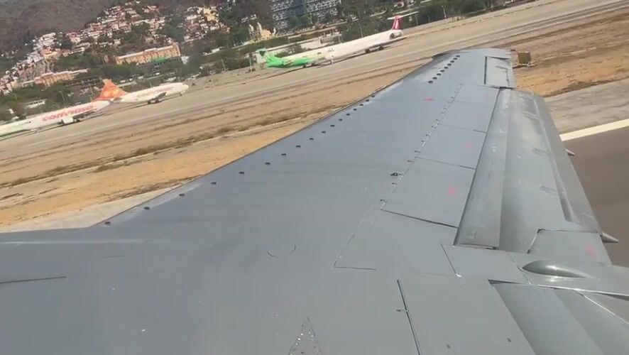 Passenger documents aircraft view from airplane window in Venezuela