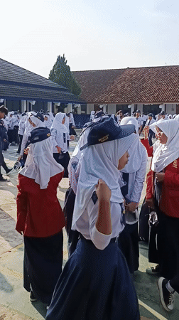 Indonesian students conduct early morning flag ceremonies across multiple locations