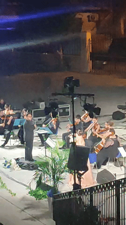 Fire, orchestra, and live painting collide at a Scordia night performance.
