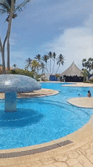 Resort guests enjoy afternoon activities at Playa El Agua beach