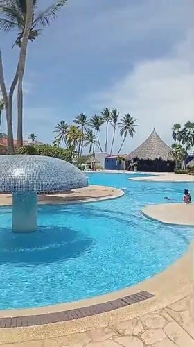Resort guests enjoy afternoon activities at Playa El Agua beach