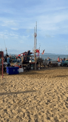 Early morning fishing market activity documented on Pattaya beach