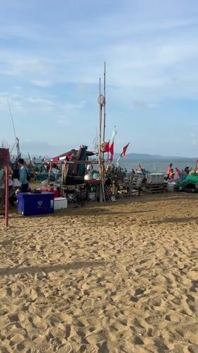 Early morning fishing market activity documented on Pattaya beach