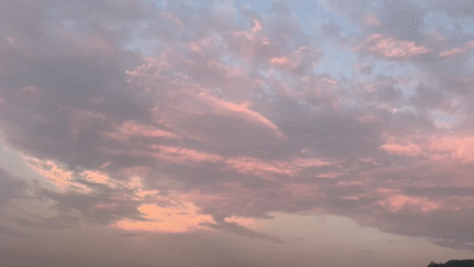 Sunset from three angles: clouds, skyline, and a cell tower