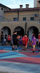 Youth basketball game on colorful court in Viadana Italy