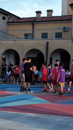 Youth basketball game on colorful court in Viadana Italy