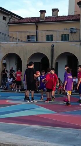 Youth basketball game on colorful court in Viadana Italy