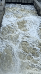 Iset River running turbulent under stormy skies in Yekaterinburg