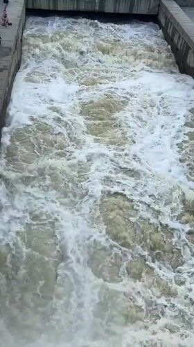 Iset River running turbulent under stormy skies in Yekaterinburg
