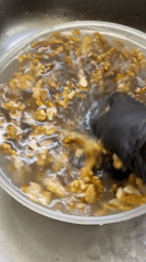 Woman prepares walnuts and berries in Izhevsk kitchen