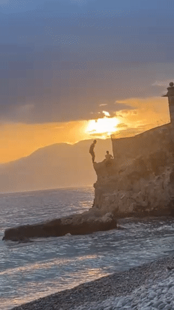 Sunset cliff diving and beach gathering documented in Rijeka