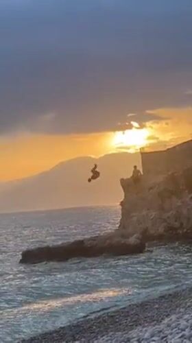 Sunset cliff diving and beach gathering documented in Rijeka