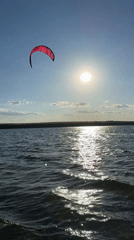 Kitesurfing and swimming on the Kyiv Reservoir, summer afternoon