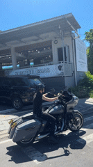 Motorcyclist waits at traffic light in Kuta Selatan