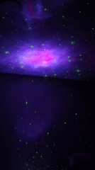 Woman relaxes under star projector in Chaikovsky bedroom