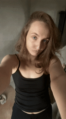 Woman takes mirror selfies in Podshivalovo, Russia apartment