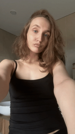 Woman takes mirror selfies in Podshivalovo, Russia apartment