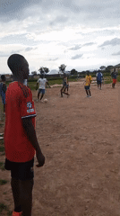 Pickup soccer on a dusty field in Beli, Nigeria