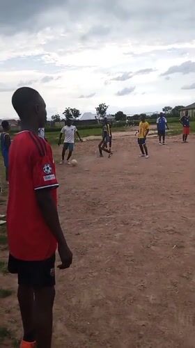 Pickup soccer on a dusty field in Beli, Nigeria