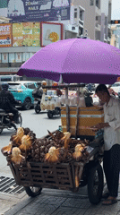 Street vendors work busy Thủ Đức roads amid motorcycle traffic
