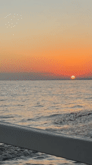 Sunset over calm seas off Banjar, Indonesia